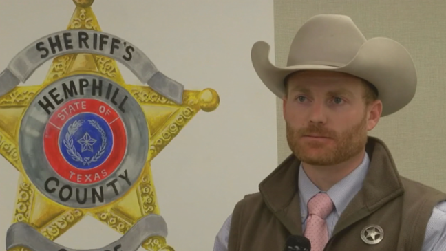Former Hemphill County Sheriff Nathan Lewis is pictured against a backdrop of the department's logo.