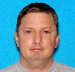 This undated Oregon driver identification photo released Monday, July 27, 2015, by the Charleston, W. Va., Police Department shows Neal Falls, of Springfield, Ore., killed by a women he attacked on July 18 in Charleston. Police are investigating whether Falls had any connection to cases of suspicious deaths and missing women in other states. (Oregon DMV/Charleston Police Department via AP)